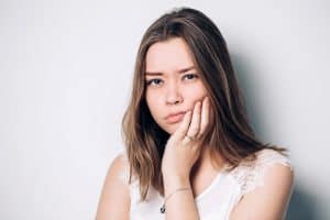 Lady suffering from toothache sensitivity