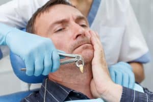 a patient undergoing tooth extraction
