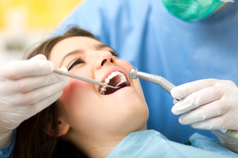 close up phot of a woman during dental check-up